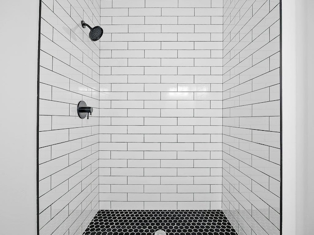 bathroom with a tile shower