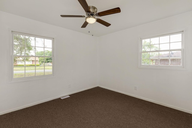 111 Linville, Moore, SC 29369 - spare room with dark carpet, ceiling fan, and baseboards