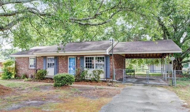 111 Linville, Moore, SC 29369 - ranch-style house featuring a gate, driveway, fence, brick siding, and a carport