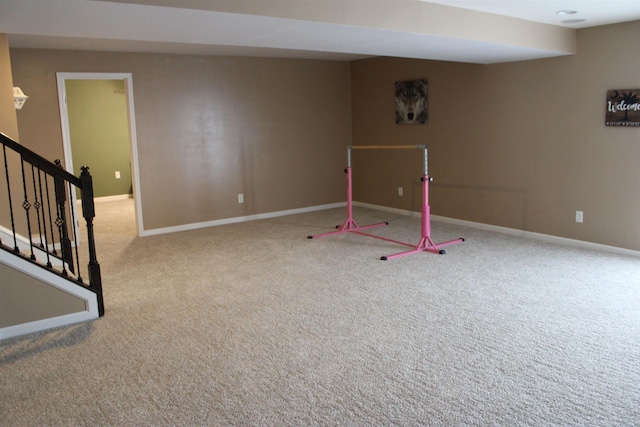 recreation room featuring carpet and baseboards