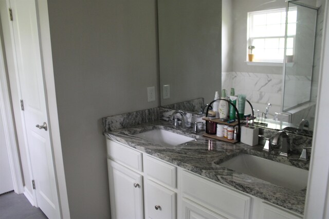 full bathroom with double vanity