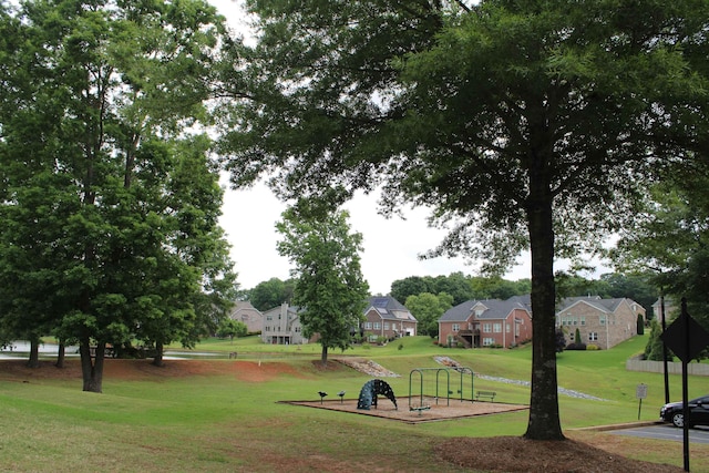 view of home's community featuring a yard and a residential view