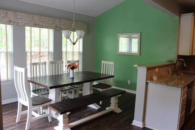 dining room featuring baseboards, a chandelier, dark wood finished floors, and vaulted ceiling