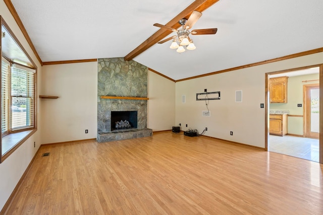 unfurnished living room featuring ceiling fan, light wood-style floors, a stone fireplace, crown molding, and baseboards