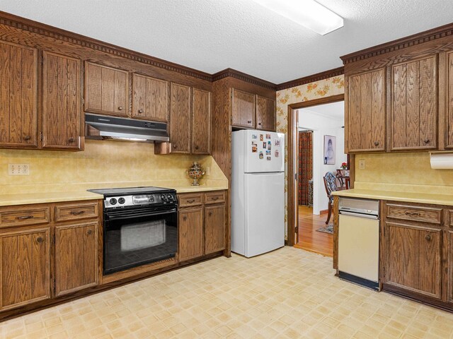 132 Rosecrest, Spartanburg, SC 29303 - kitchen with freestanding refrigerator, under cabinet range hood, black electric range, light floors, and light countertops