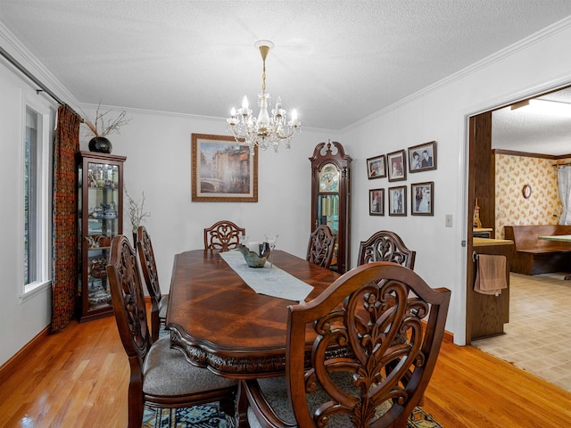 132 Rosecrest, Spartanburg, SC 29303 - dining space with light wood-style floors, a chandelier, ornamental molding, and baseboards