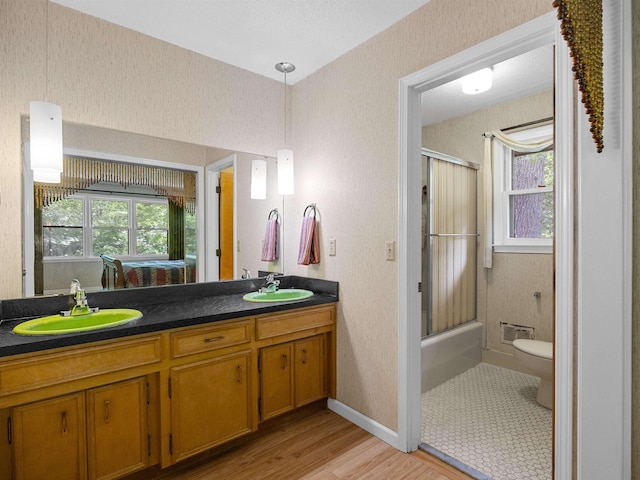 132 Rosecrest, Spartanburg, SC 29303 - full bath with double vanity, healthy amount of natural light, wood finished floors, and toilet