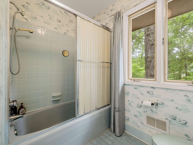 132 Rosecrest, Spartanburg, SC 29303 - full bathroom featuring wallpapered walls, bath / shower combo with glass door, toilet, and tile patterned floors
