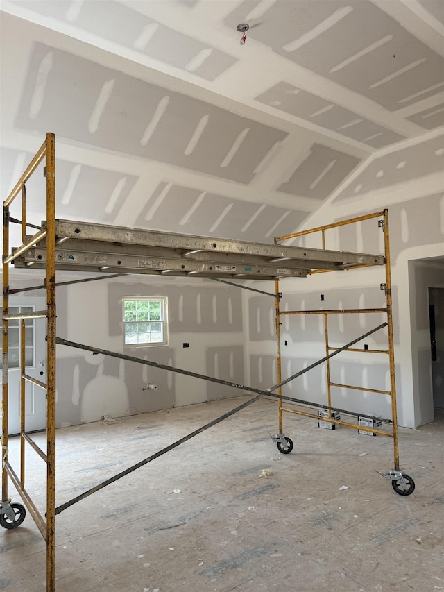 miscellaneous room with lofted ceiling