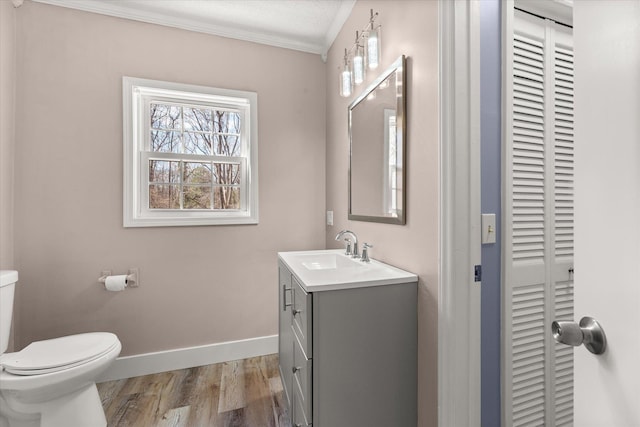 216 Ashmore, Greer, SC 29650 - half bathroom featuring wood finished floors, toilet, baseboards, a closet, and vanity