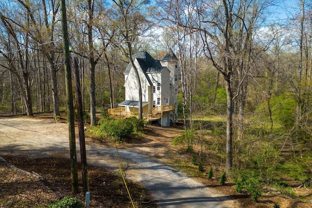 216 Ashmore, Greer, SC 29650 - view of side of home featuring a deck, stairway, and a wooded view