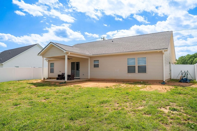 back of property featuring ceiling fan and a patio area
