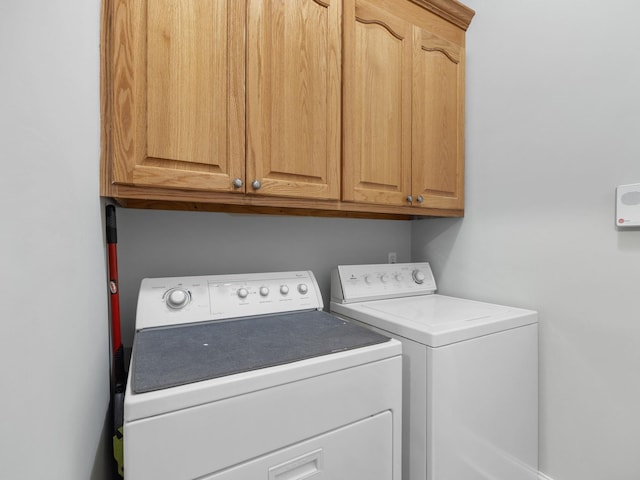 laundry room featuring cabinet space and washer and dryer