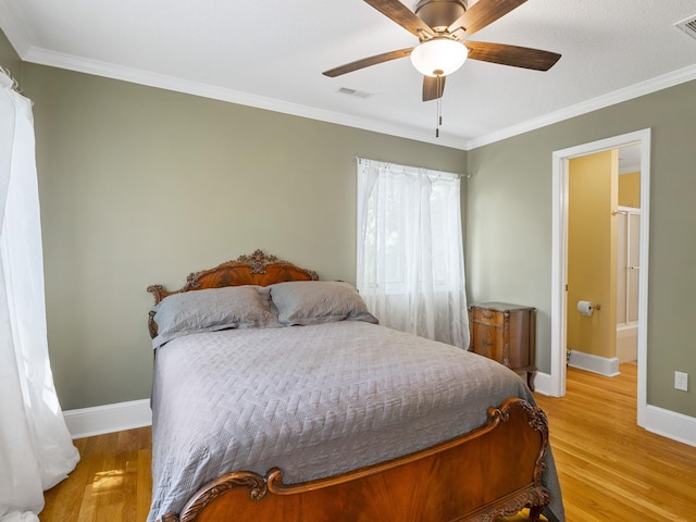 bedroom featuring baseboards, light wood-style floors, crown molding, and a ceiling fan
