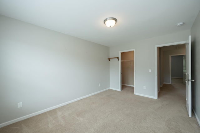 173 Tiara Rdg, Duncan, SC 29334 - unfurnished bedroom with light colored carpet, baseboards, a spacious closet, and a closet