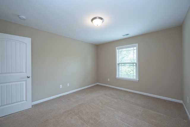 173 Tiara Rdg, Duncan, SC 29334 - empty room with a smoke detector, light colored carpet, and baseboards