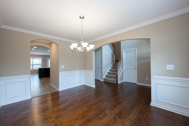 173 Tiara Rdg, Duncan, SC 29334 - unfurnished dining area featuring arched walkways, a chandelier, dark wood-type flooring, stairway, and wainscoting