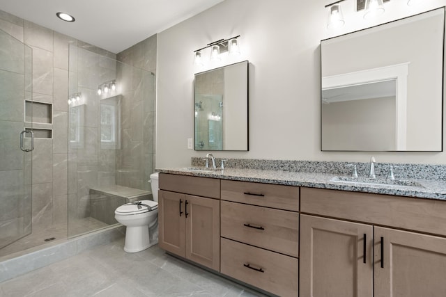 full bathroom featuring toilet, a shower stall, double vanity, tile patterned floors, and recessed lighting