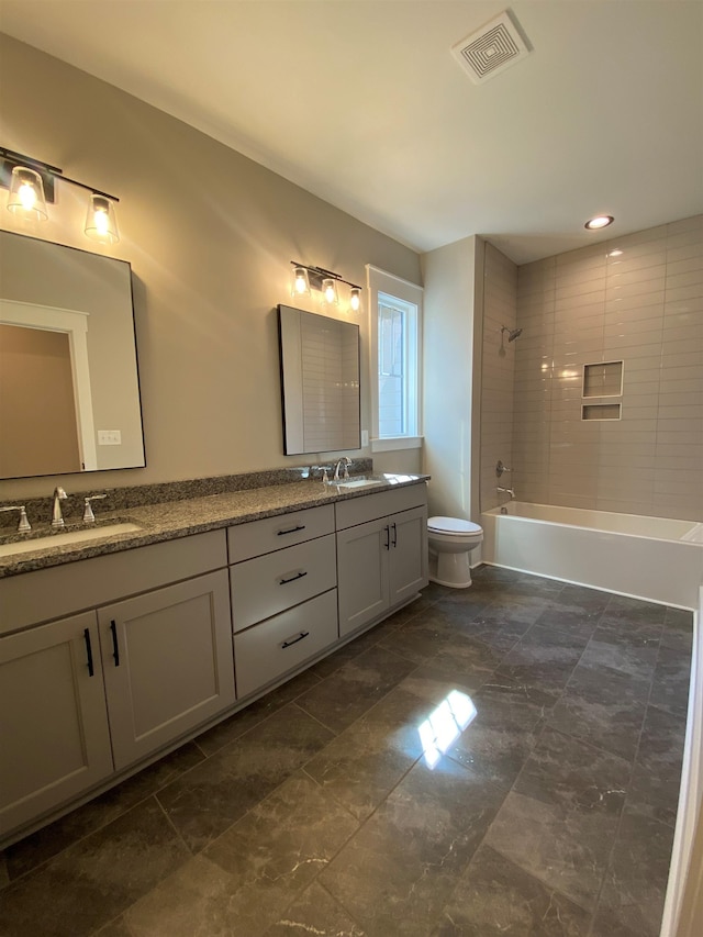 full bathroom with toilet,  shower combination, double vanity, and recessed lighting