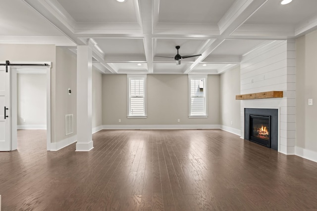 unfurnished living room featuring a ceiling fan, baseboards, a fireplace, wood finished floors, and beamed ceiling