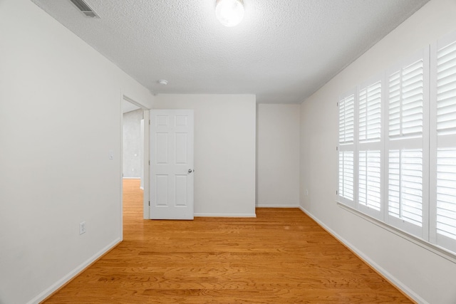 2 Birch Tree, Greer, SC 29651 - spare room with a textured ceiling, light wood-type flooring, and baseboards