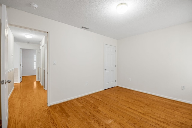 2 Birch Tree, Greer, SC 29651 - unfurnished room with light wood-type flooring, a textured ceiling, baseboards, and a smoke detector