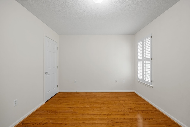 2 Birch Tree, Greer, SC 29651 - unfurnished room featuring light wood-style flooring, a textured ceiling, and baseboards