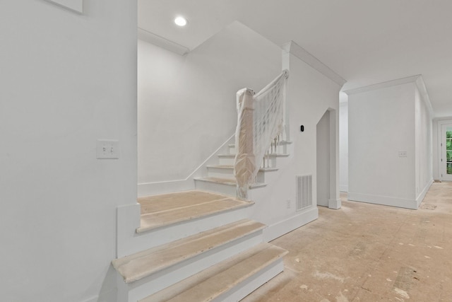 staircase with baseboards and recessed lighting