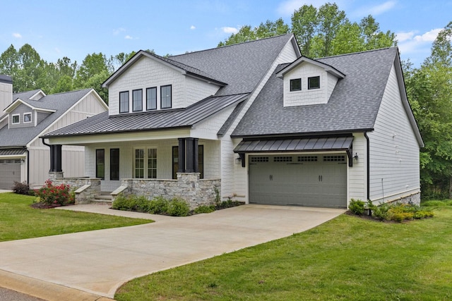 modern farmhouse with a standing seam roof, roof with shingles, a porch, a front lawn, and driveway