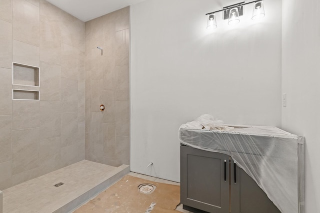 full bath featuring tiled shower
