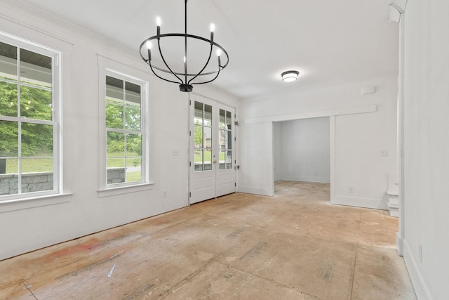 unfurnished dining area featuring a chandelier and ornamental molding