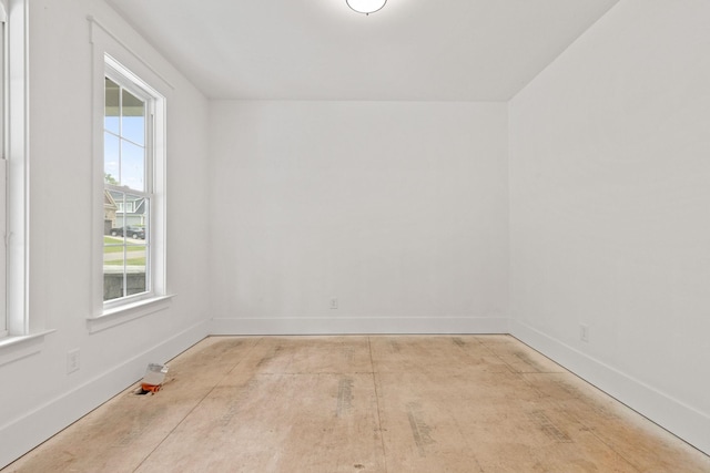 empty room featuring baseboards