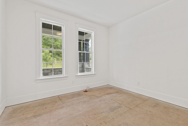empty room with baseboards