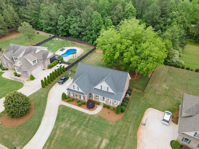 aerial view of property and surrounding area with a pool