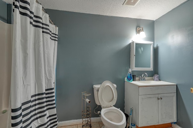 full bathroom featuring vanity, a textured ceiling, a shower with curtain, toilet, and tile patterned floors