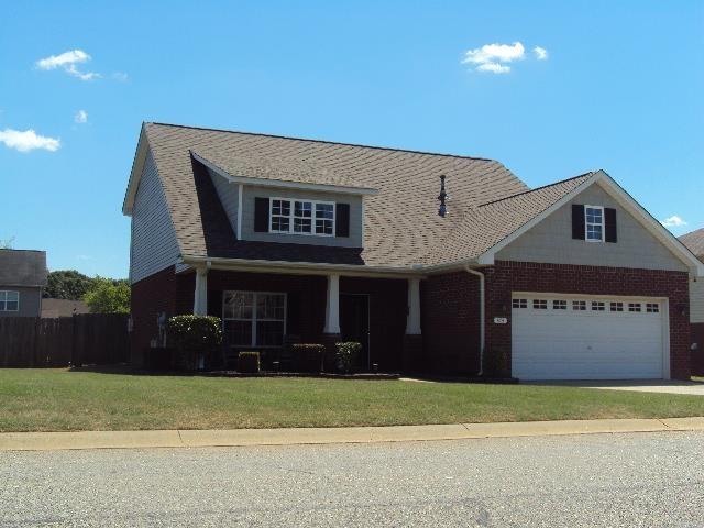 474 Slate, Boiling Springs, SC 29316 - view of front of house featuring a garage, concrete driveway, a porch, and brick siding