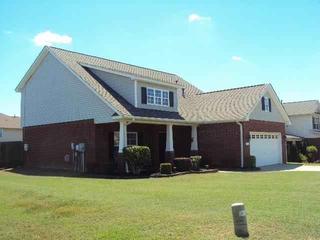 474 Slate, Boiling Springs, SC 29316 - view of front of property with an attached garage, a front yard, brick siding, and concrete driveway