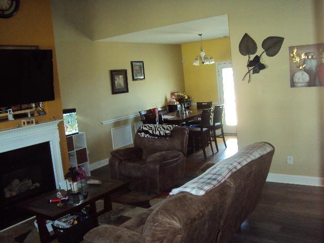 474 Slate, Boiling Springs, SC 29316 - living area with baseboards, wood finished floors, and a fireplace