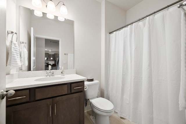 full bath featuring toilet and vanity