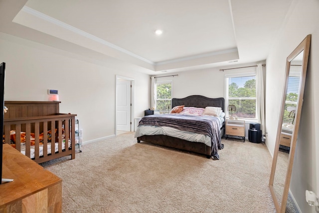 bedroom featuring a tray ceiling, carpet, crown molding, multiple windows, and recessed lighting