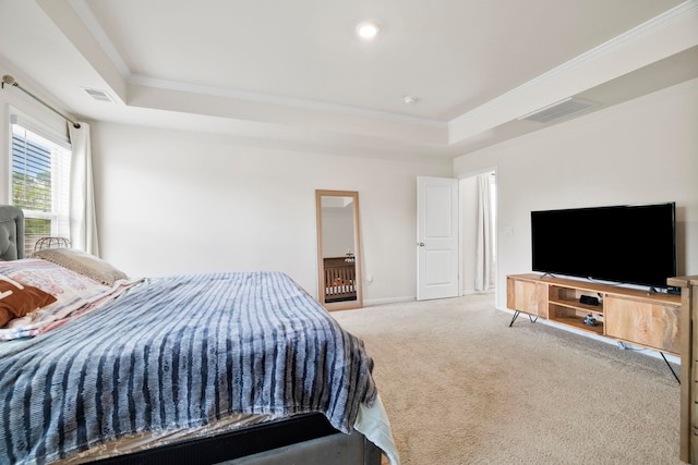 bedroom with ornamental molding, carpet, a tray ceiling, and baseboards