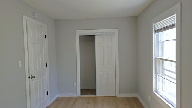 203 N Evans, Union, SC 29379 - unfurnished bedroom featuring light wood-style flooring, a closet, and baseboards