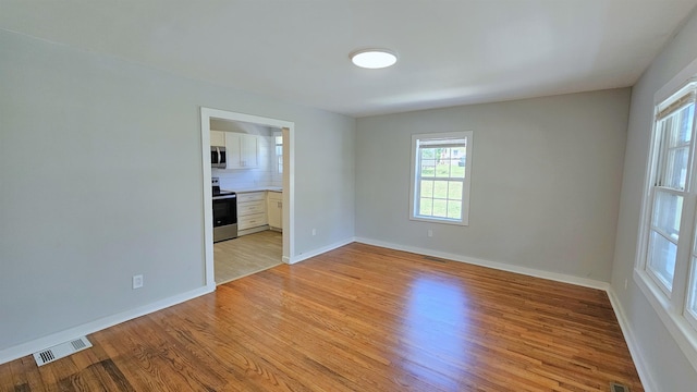 203 N Evans, Union, SC 29379 - empty room with light wood-style flooring and baseboards