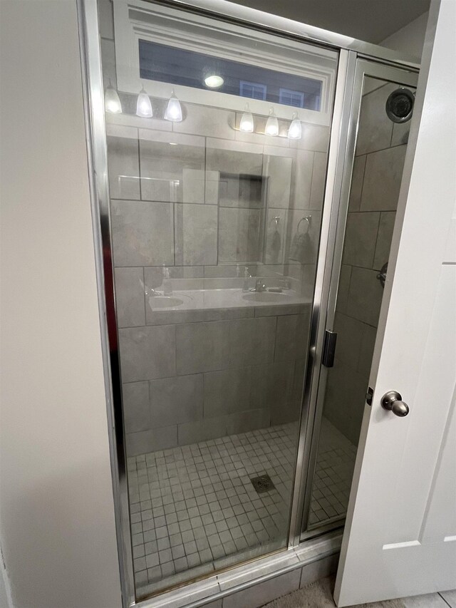 bathroom featuring a shower stall