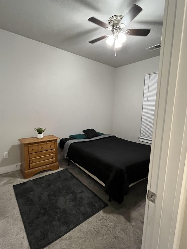 bedroom featuring carpet flooring, a ceiling fan, and baseboards