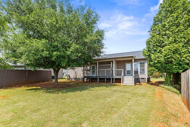 rear view of house with crawl space and a wooden deck