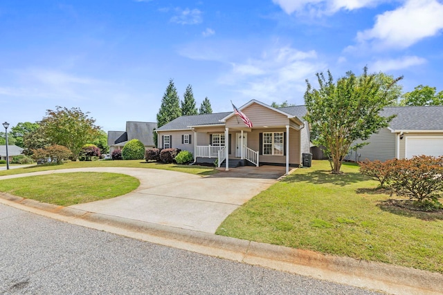 ranch-style home with curved driveway, a porch, and a front lawn