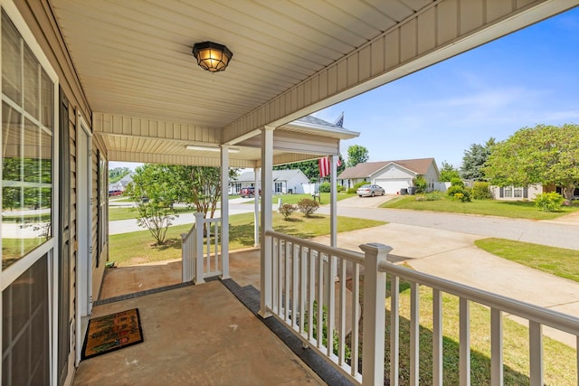 view of patio featuring a porch and a residential view
