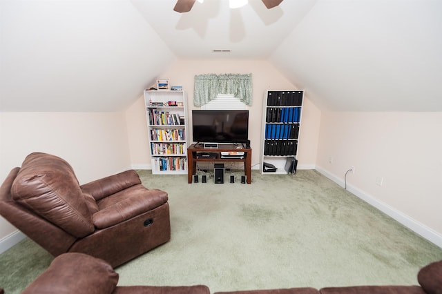 carpeted living room with a ceiling fan, lofted ceiling, and baseboards