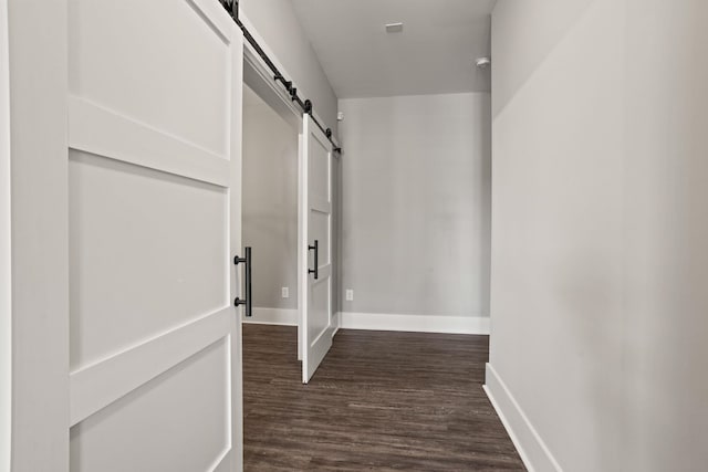 1305 S Pinot, Duncan, SC 29334 - hallway with a barn door, dark wood-style floors, and baseboards